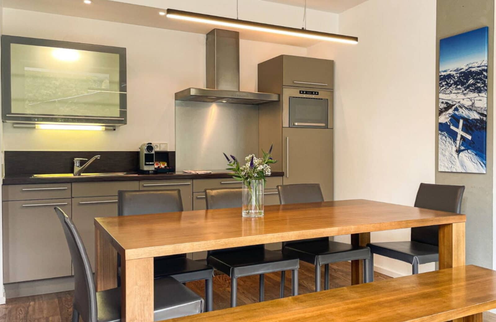 Kitchenette and dining area; table with bench and chair seating for 6