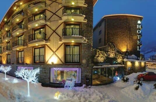 Hotel exterior with private balconies and street-level ski storage access