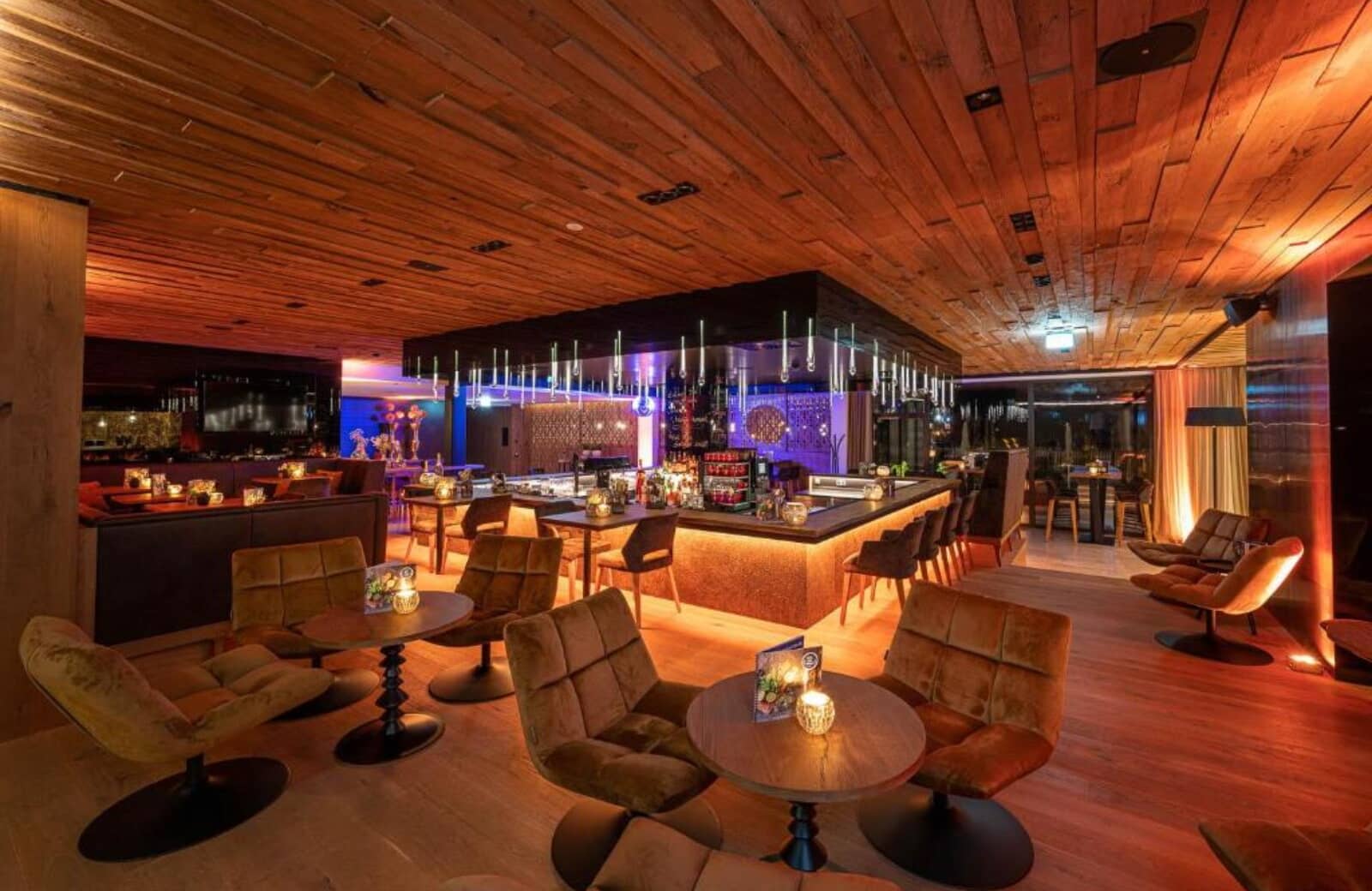 Lounge area with full-service bar and reclaimed wood ceiling