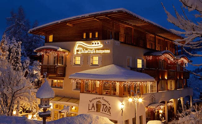 Boutique hotel exterior with on-site pizzeria and restaurant