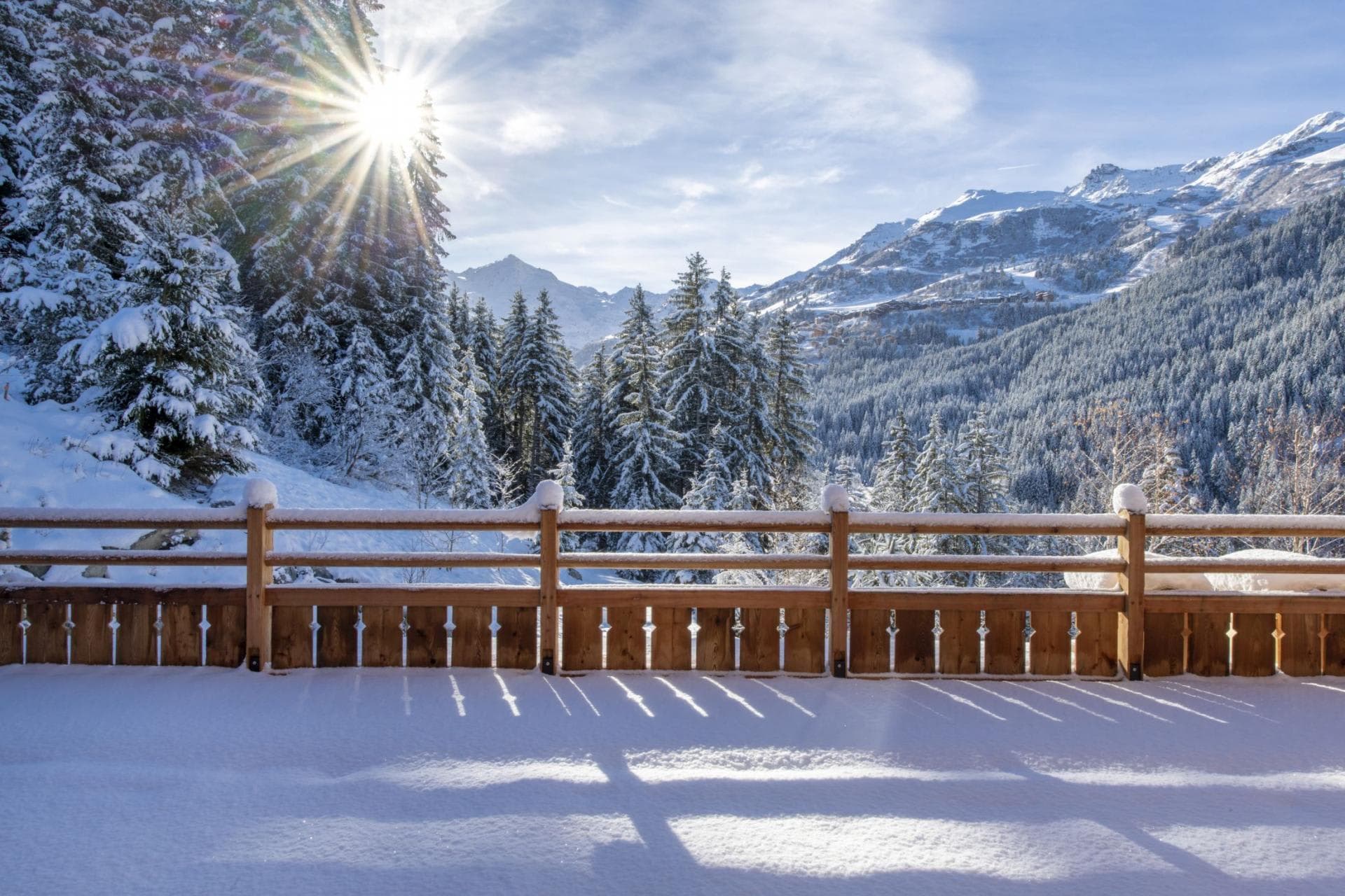 Private deck with wood railing and panoramic alpine valley views