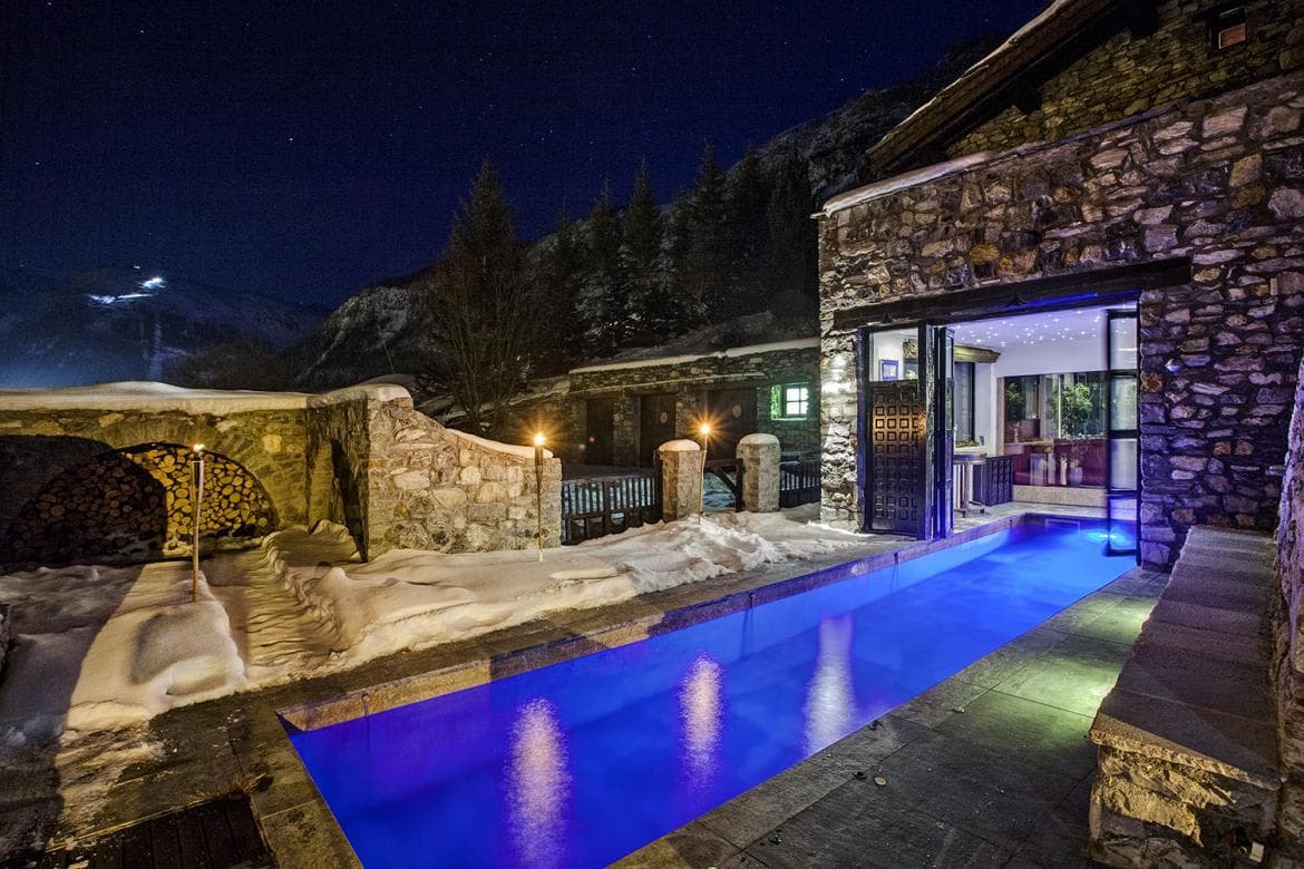 Heated lap pool with swim-in access from indoor spa area