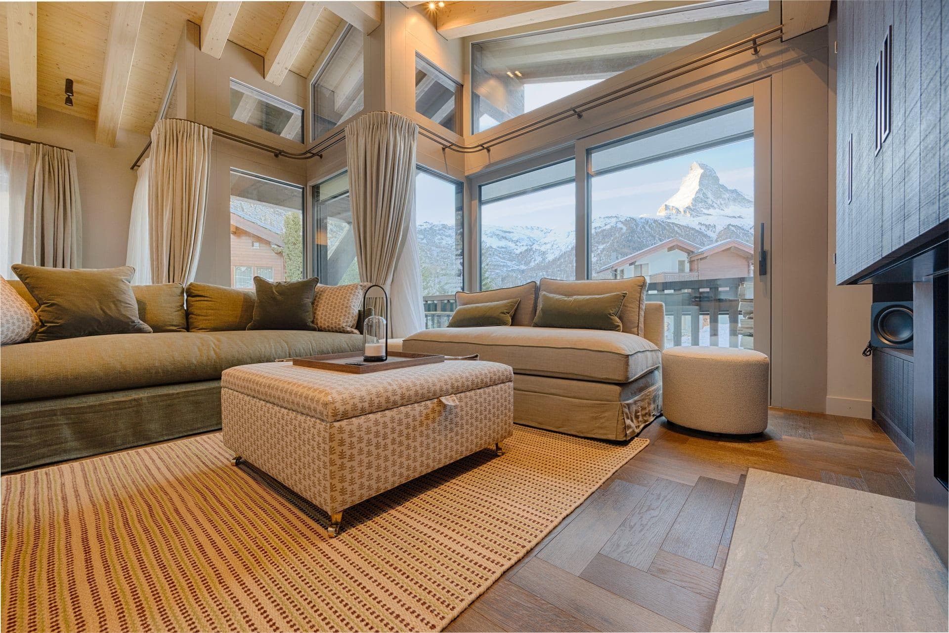 Living area with floor-to-ceiling windows and Matterhorn mountain views