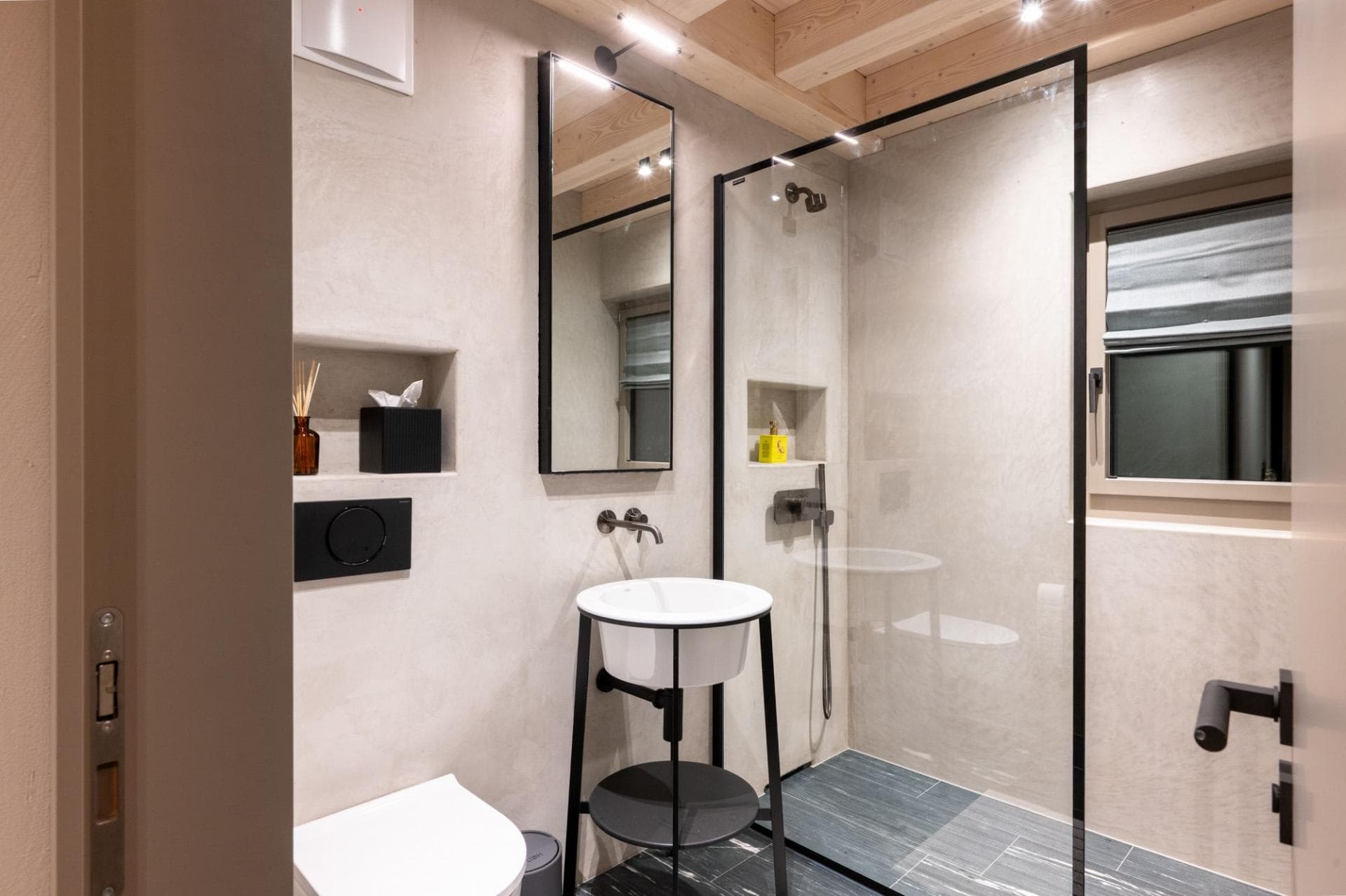 Bathroom with walk-in rainfall shower and pedestal sink