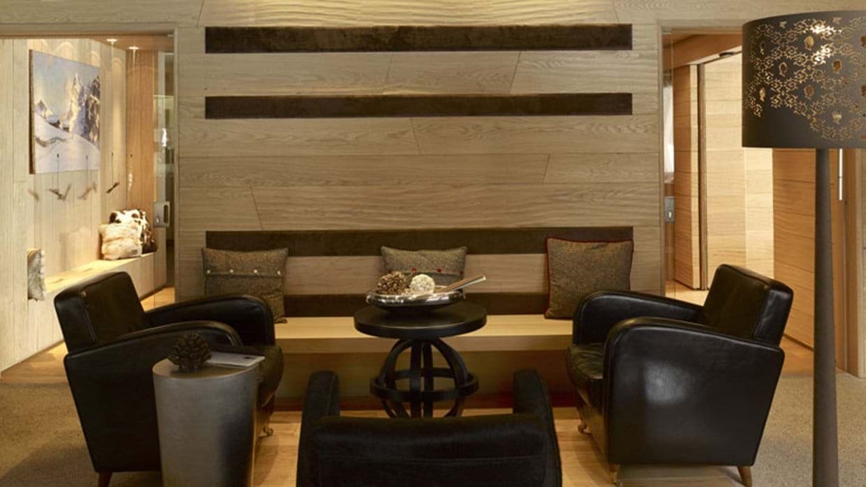 Sitting area with leather club chairs and integrated bench seating