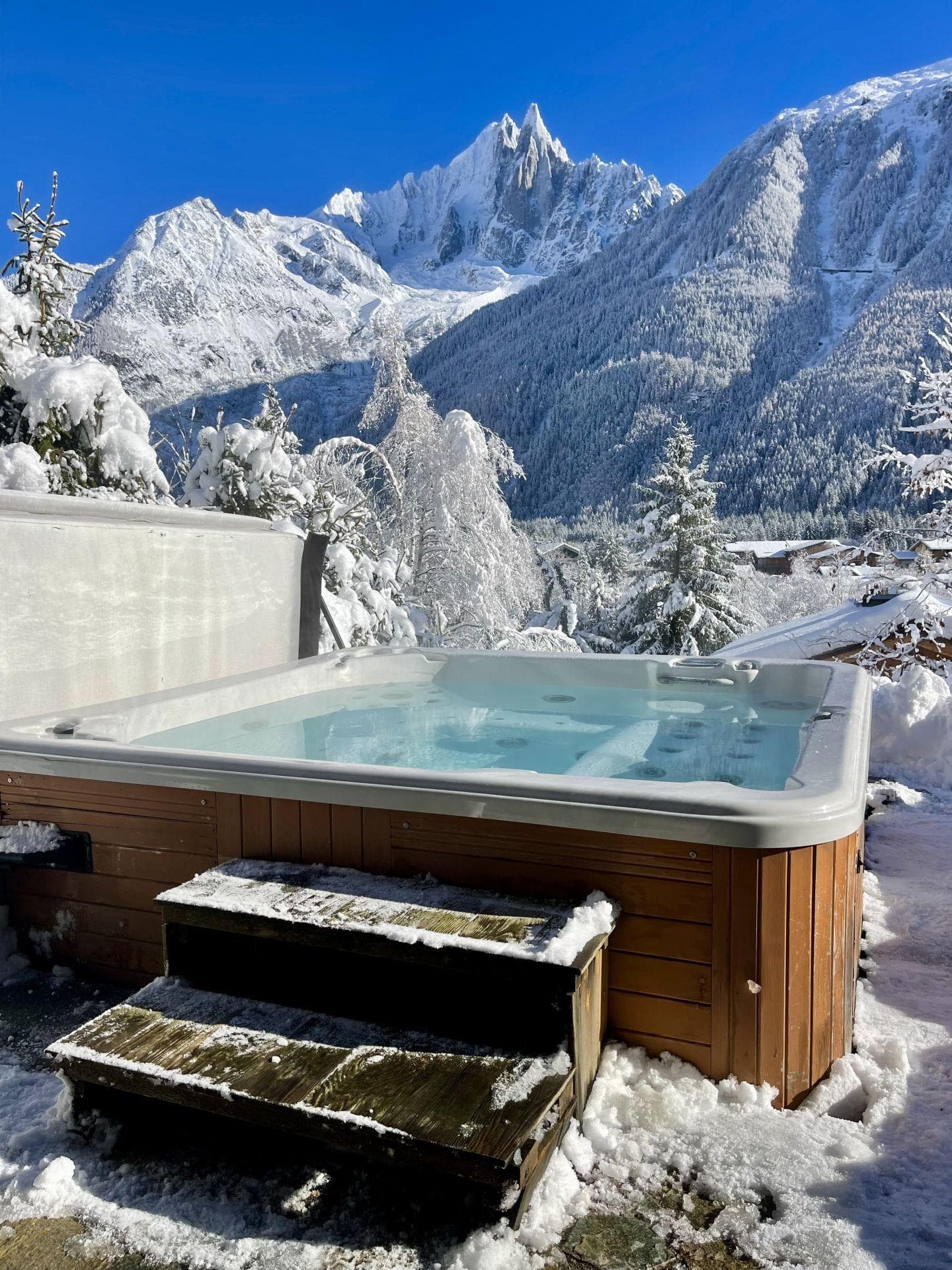 Outdoor hot tub with panoramic Mont Blanc massif views