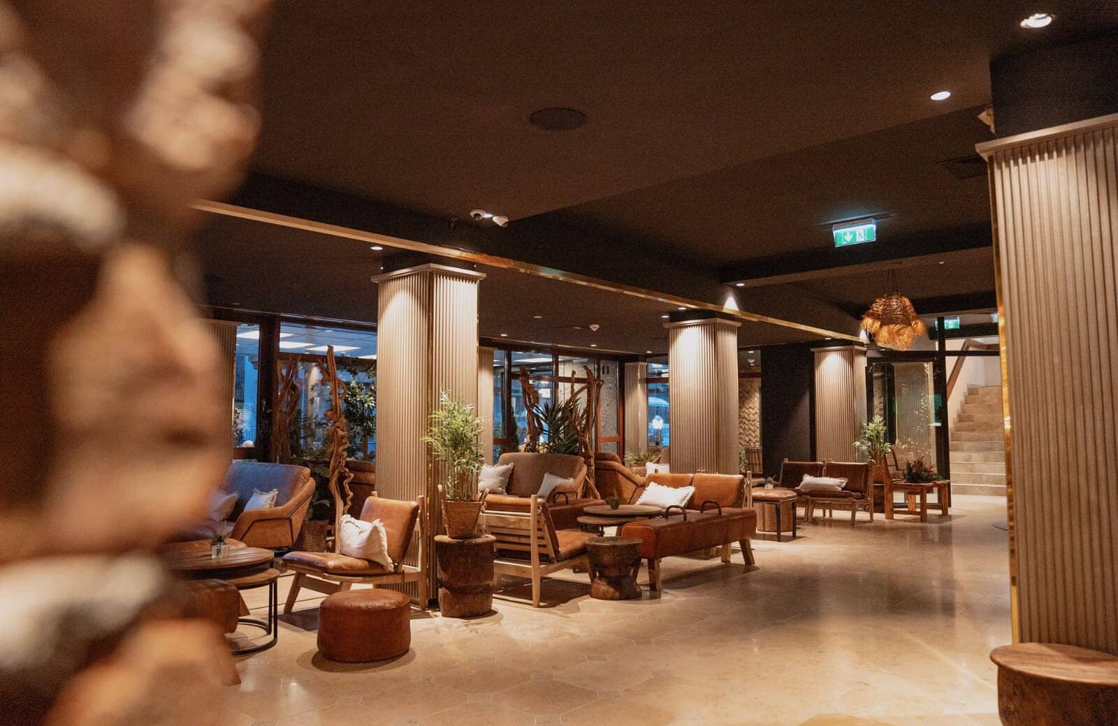 Shared lounge area with leather seating and accessible elevator access