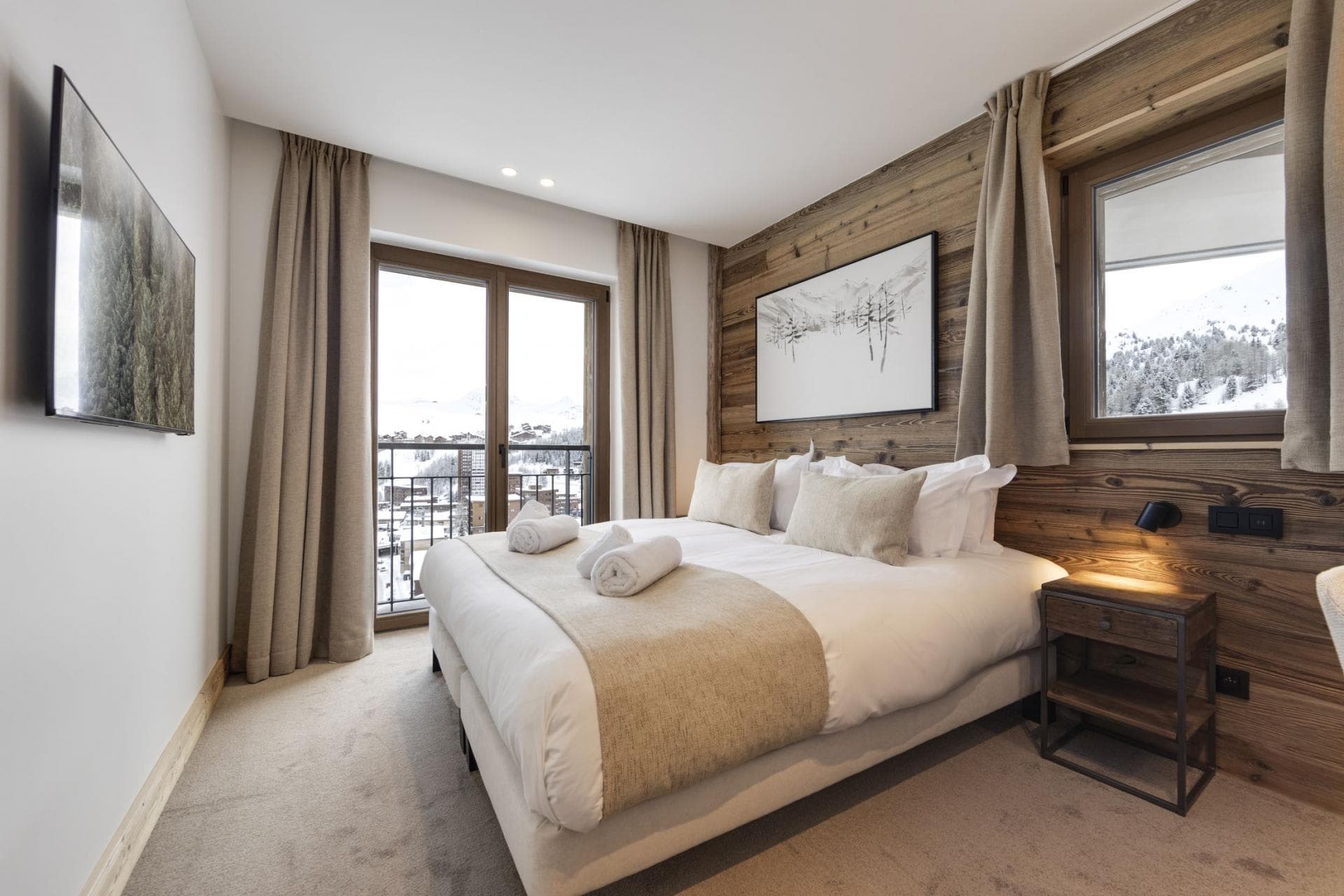 Guest bedroom with king bed and private balcony access