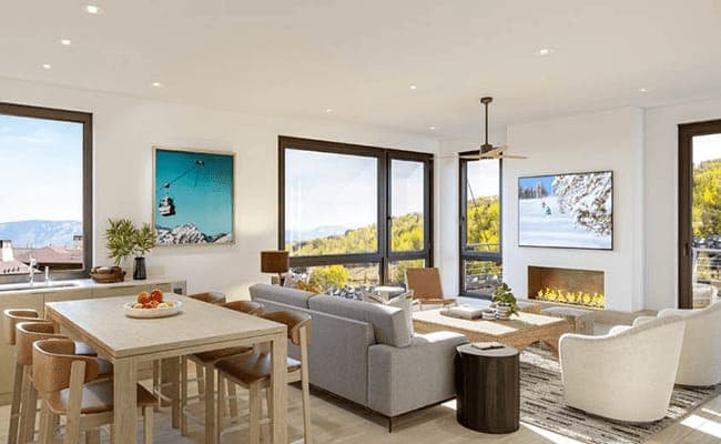 Open living area with gas fireplace and dining seating for 6