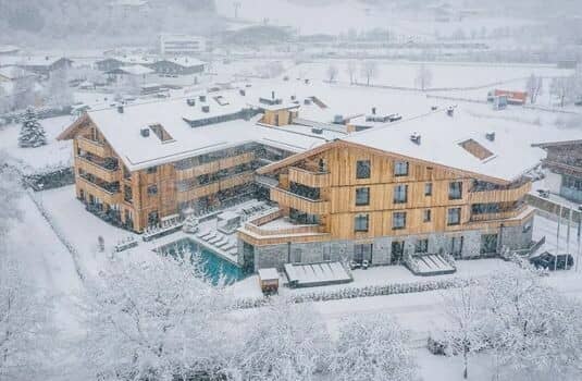 Chalet exterior with heated outdoor pool and private balconies