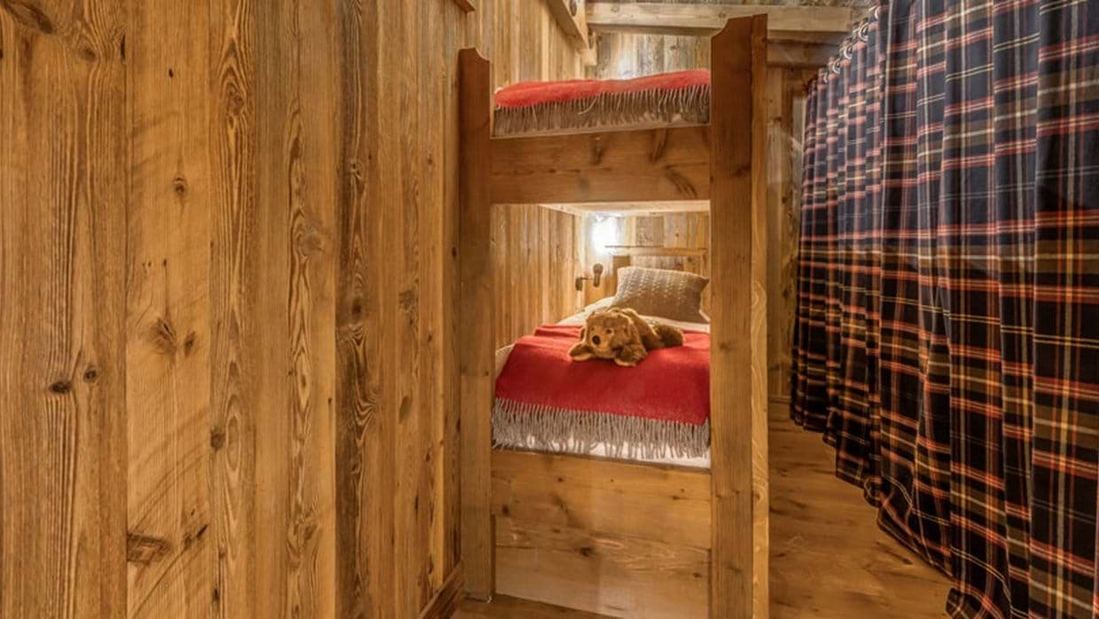 Bunk room with timber twin beds and individual reading lights