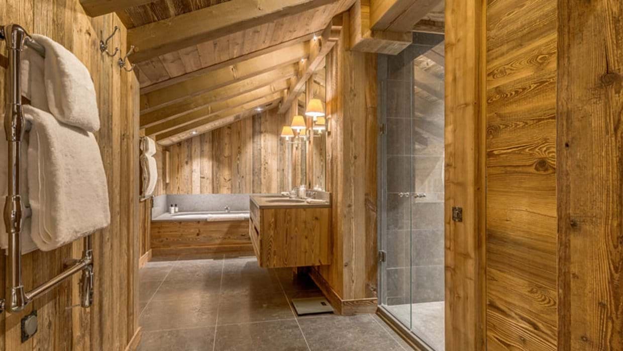 Bathroom with dual vanity, walk-in shower, and heated towel rail