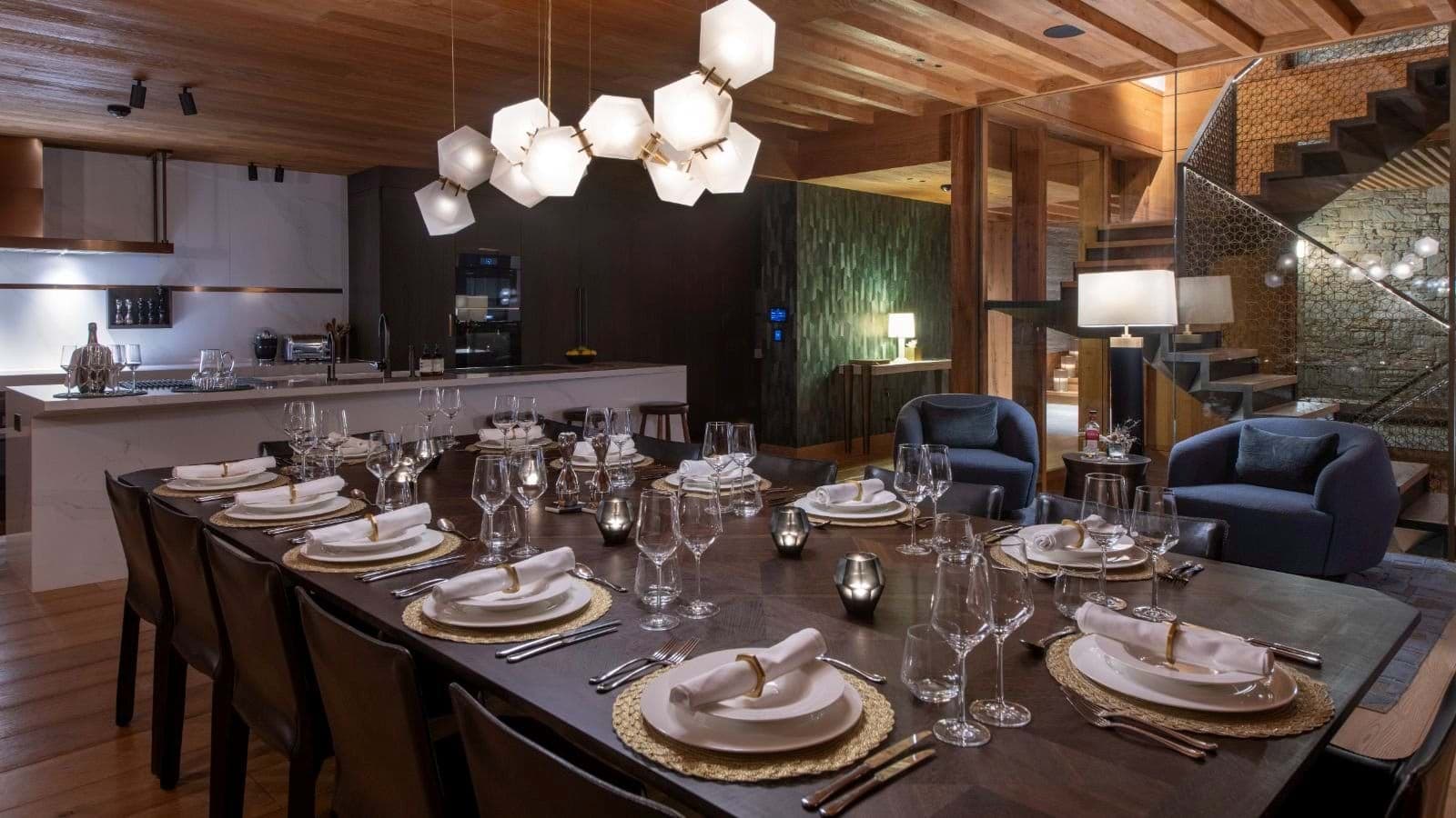 Dining table seats 12; adjacent to kitchen island and lounge area