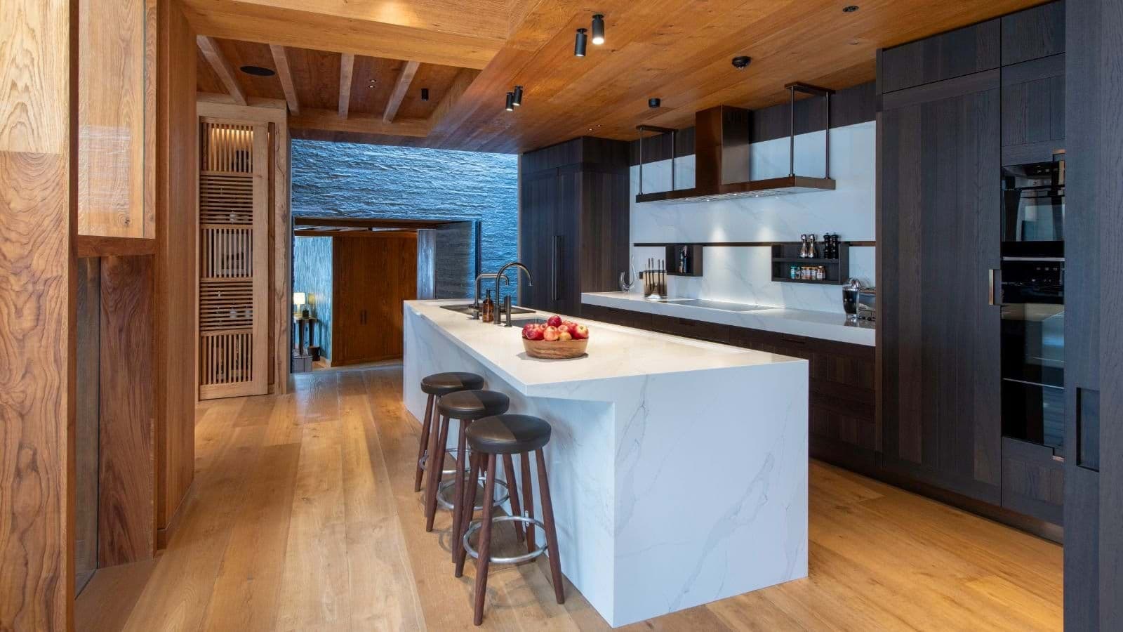 Kitchen island with seating for 3 and integrated induction cooktop