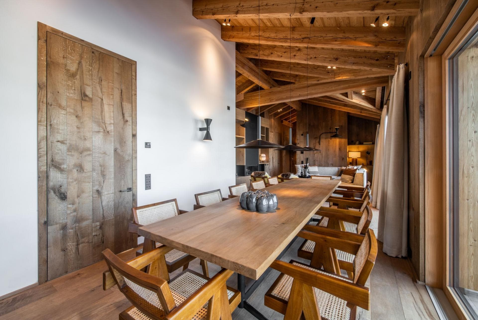 Dining area seats 10; features vaulted timber ceilings and patio access