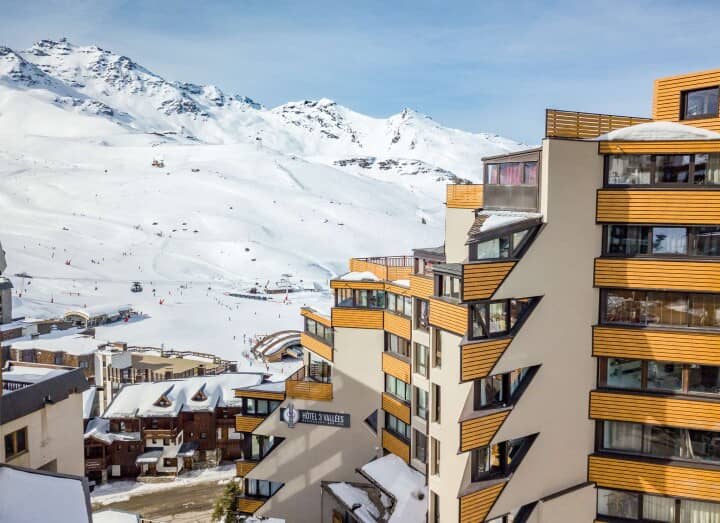 Slopeside exterior with panoramic mountain views and direct access to ski trails