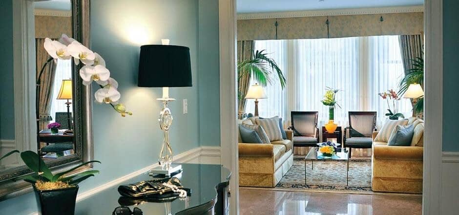 Foyer looking into living room with seating for at least 6