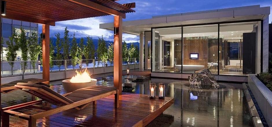 Rooftop terrace with fire pit, sun loungers, and reflecting pool