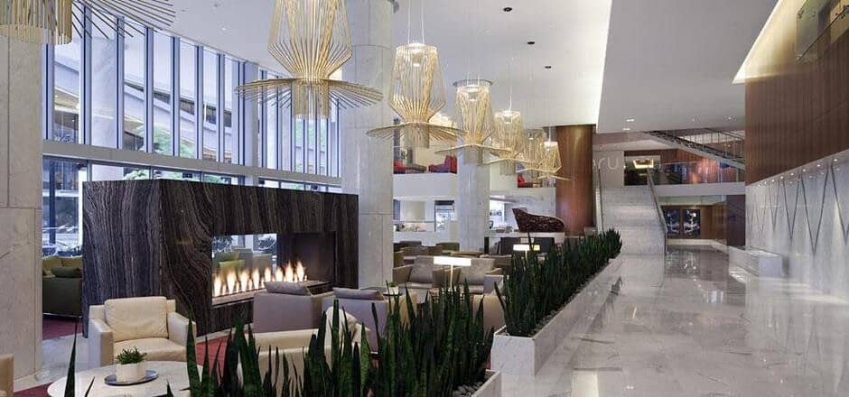 Building lobby with double-sided gas fireplace and lounge seating