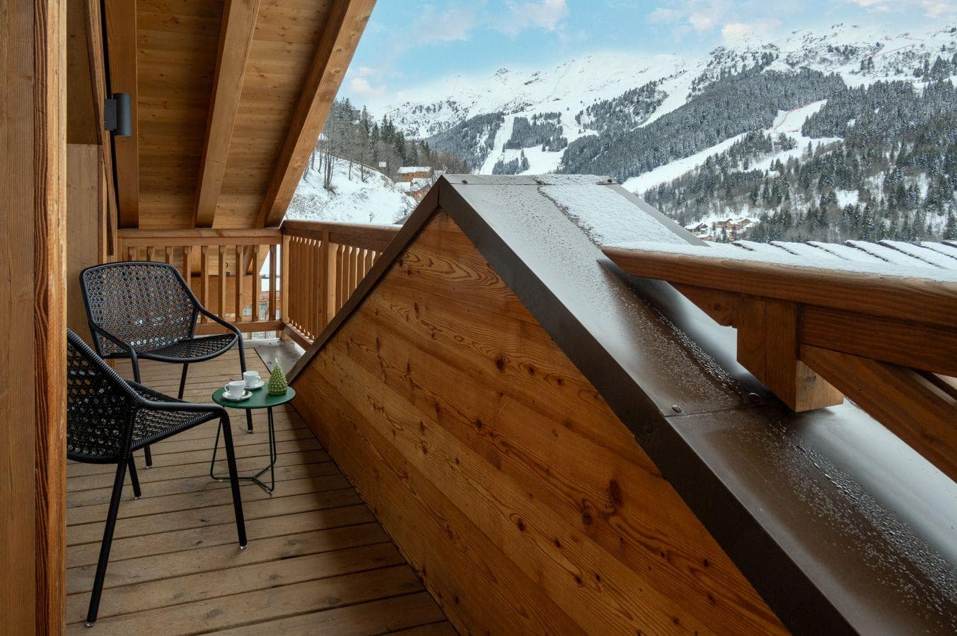 Private balcony with seating for two and ski slope views