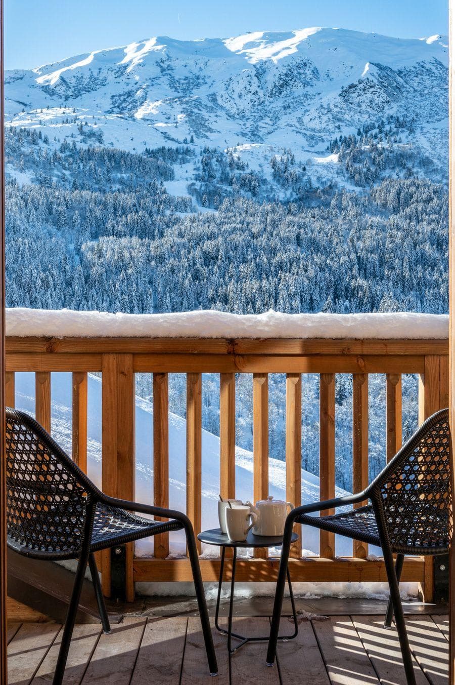 Private balcony with seating for two and mountain views