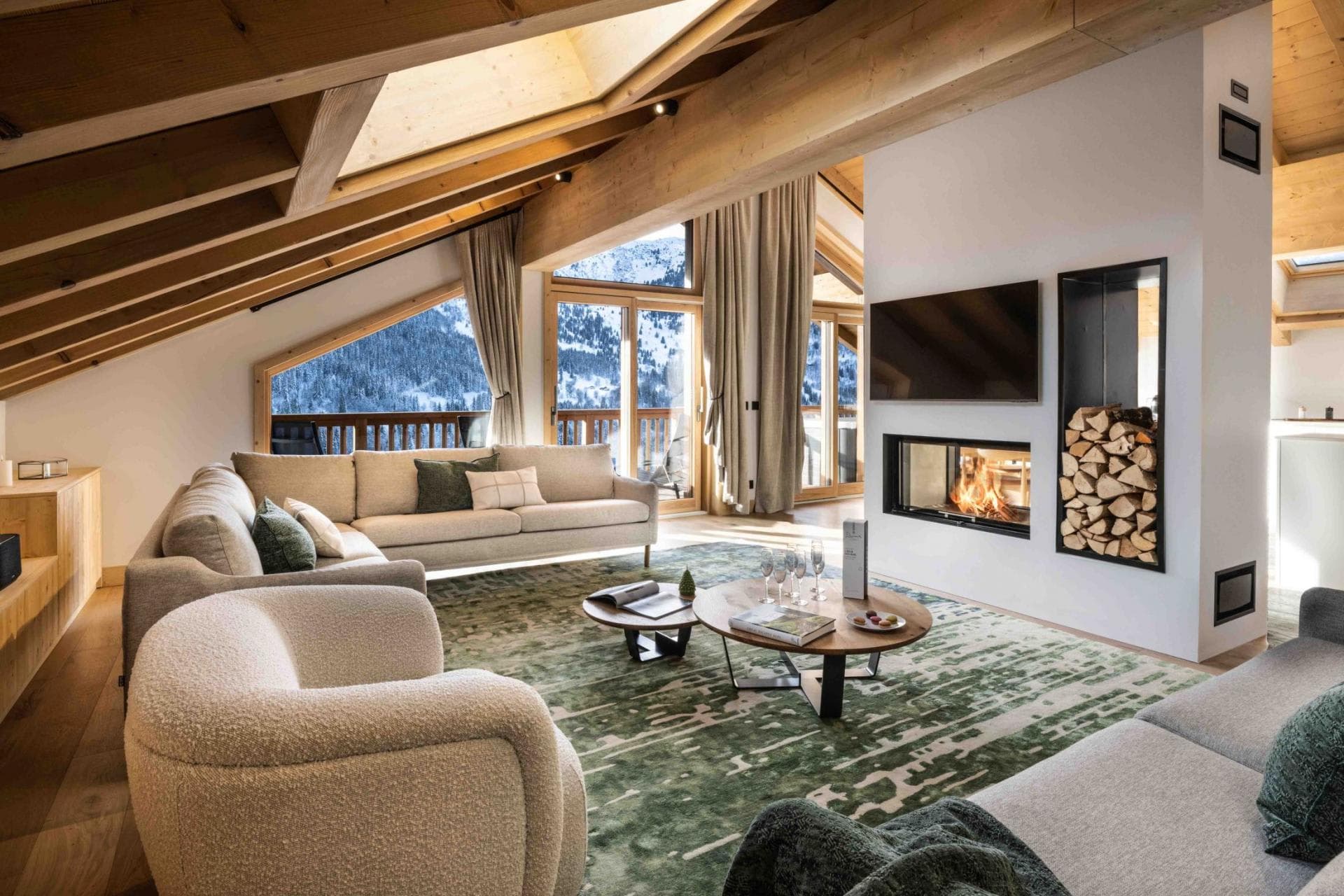 Living area with wood-burning fireplace and mountain-view balcony