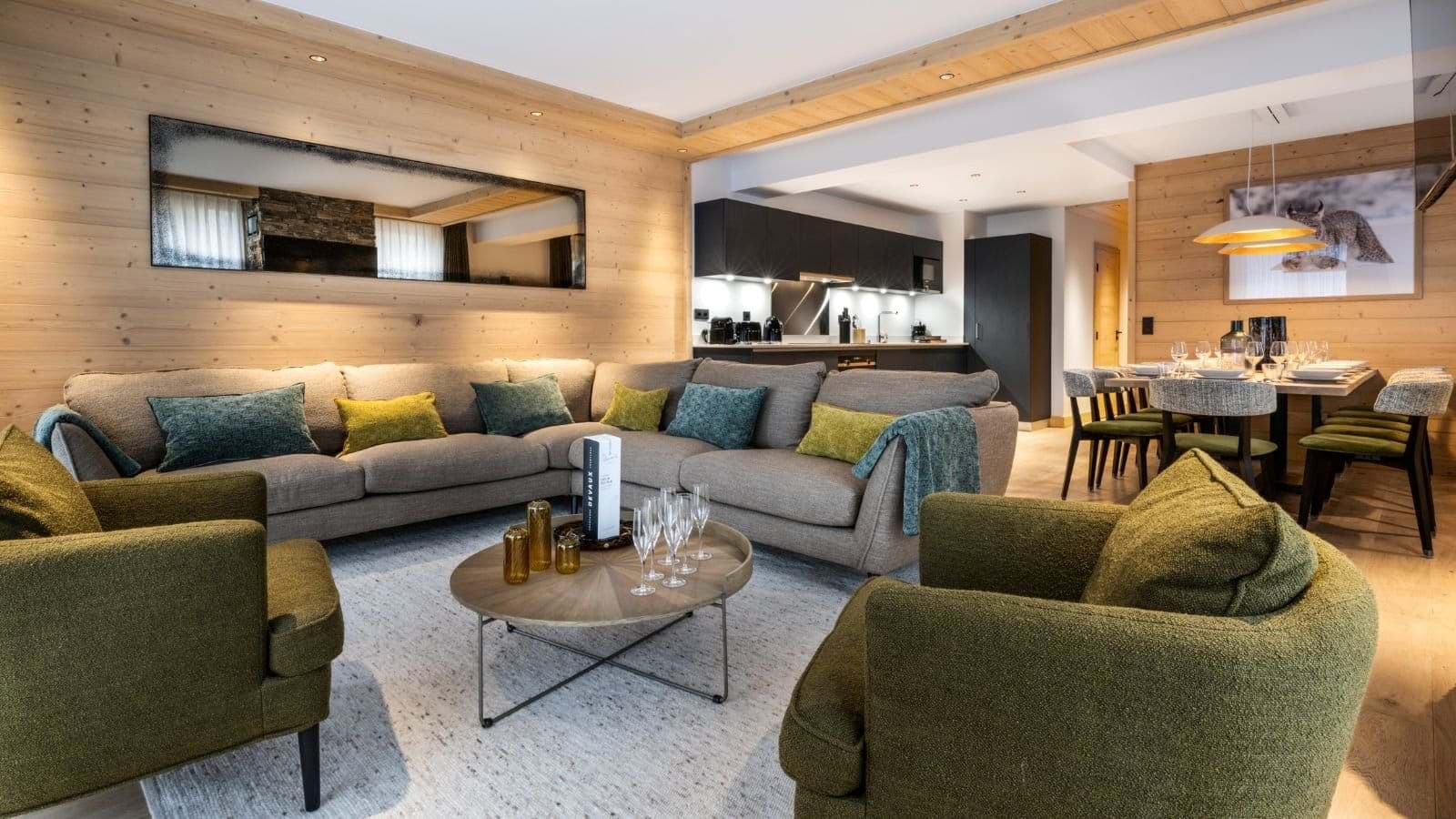 Open-plan living area with sectional seating for 8 near dining table