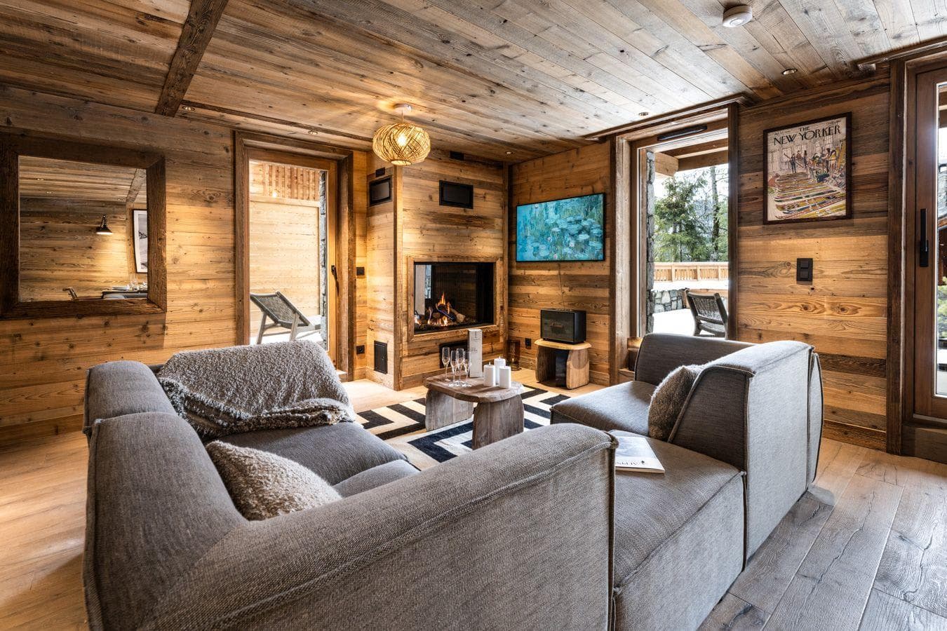 Living area with wood-burning fireplace and direct terrace access