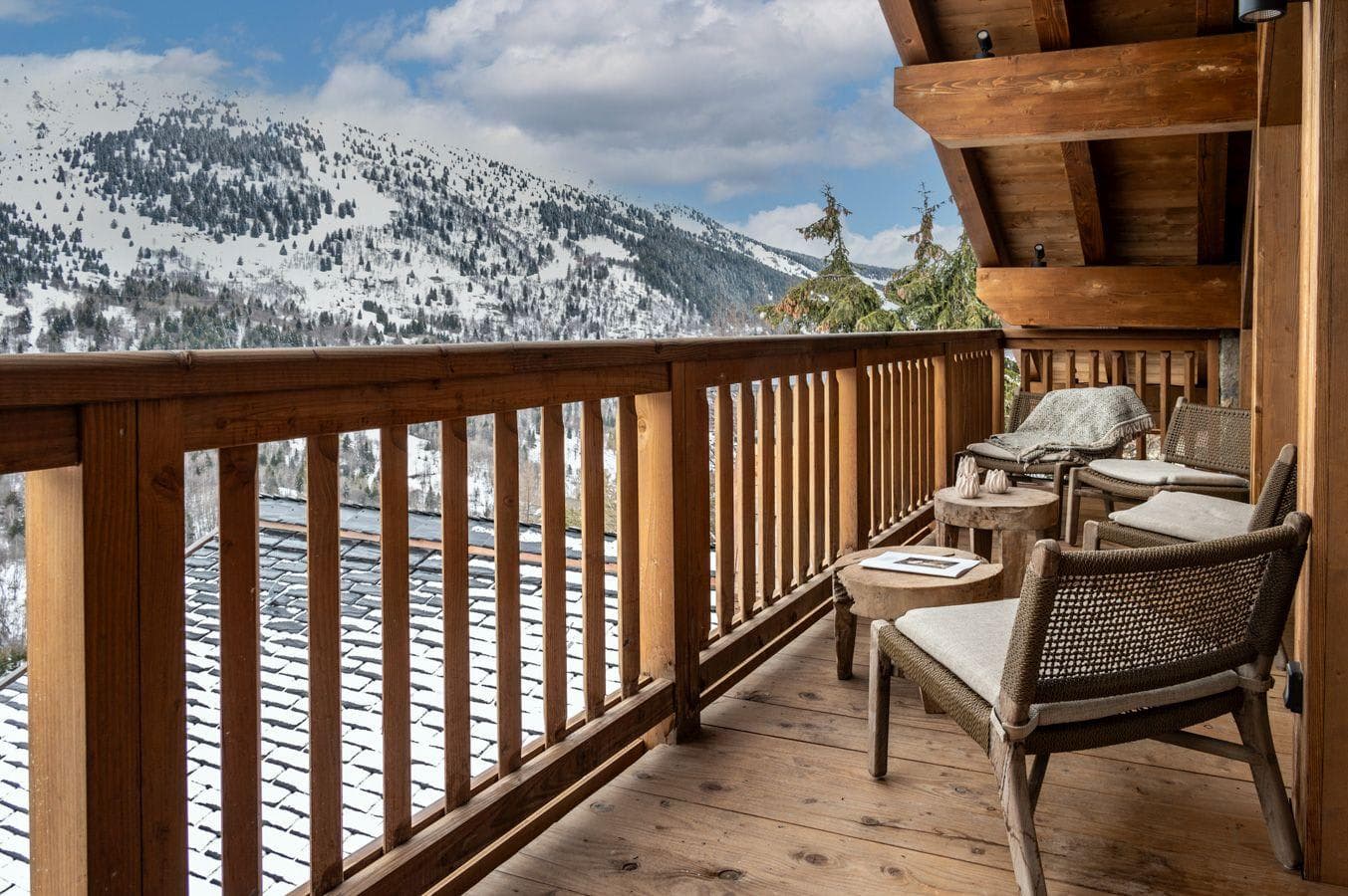 Covered balcony with seating for 3 and mountain views