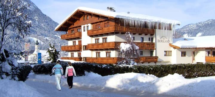 Chalet exterior featuring private balconies and walking access to nearby village center