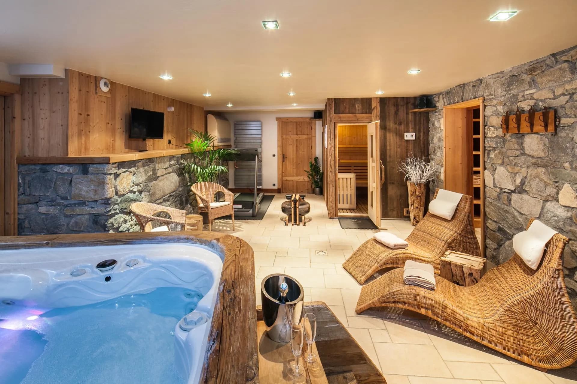 Indoor jacuzzi beside the sauna and fitness equipment