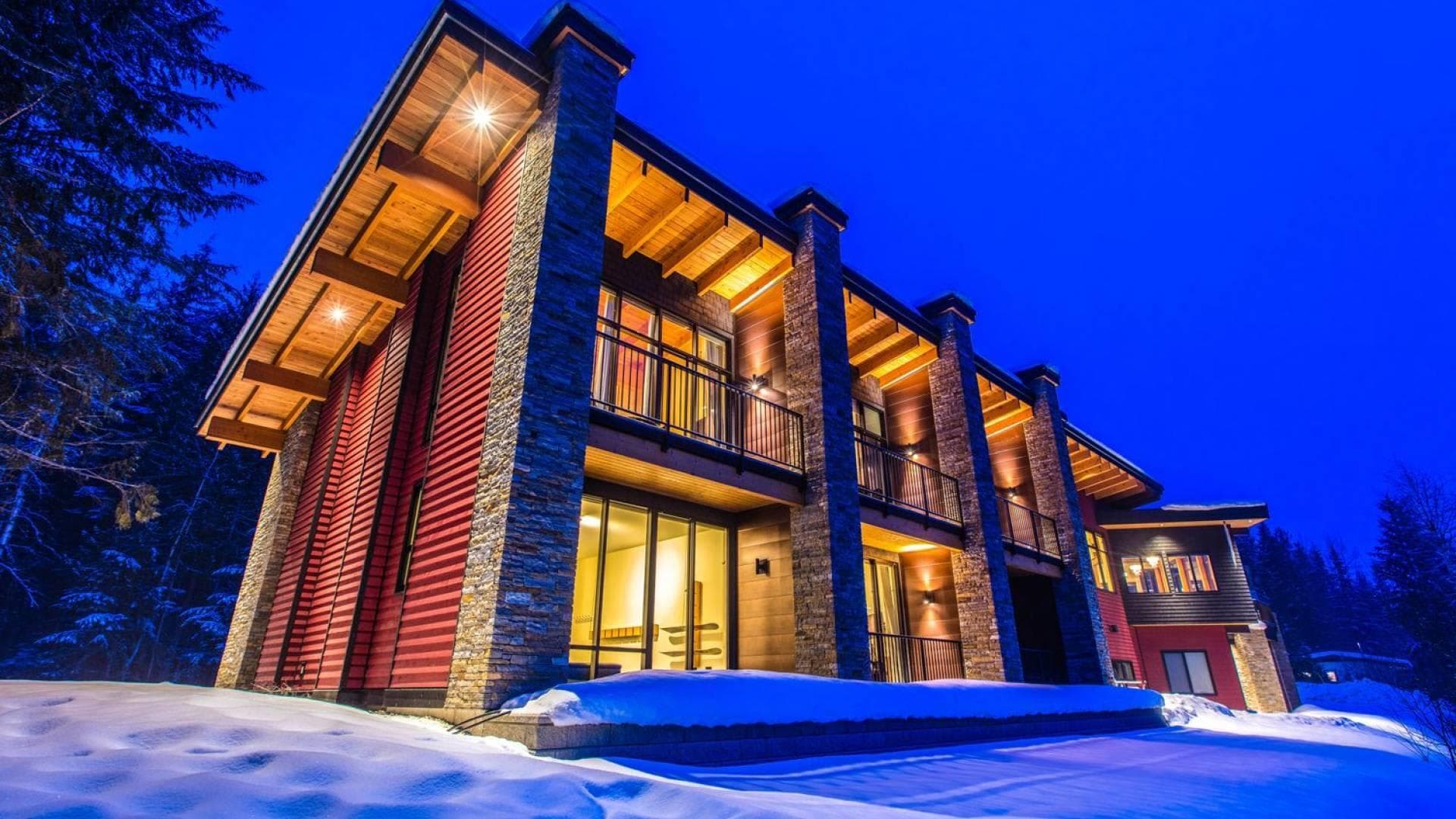 Multi-story lodge with stone pillars and private balconies