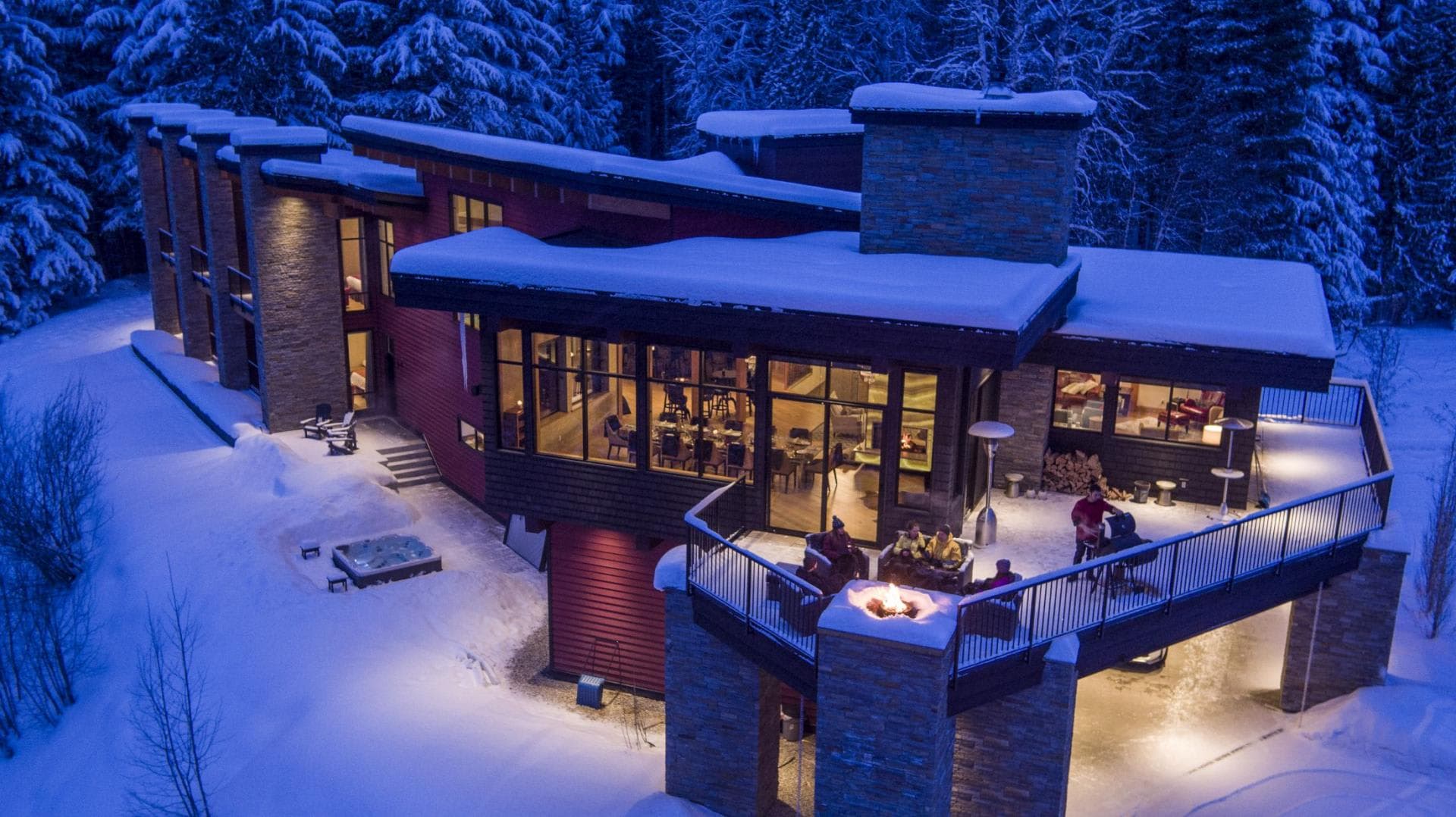 Exterior with ground-level hot tub and elevated fire pit deck