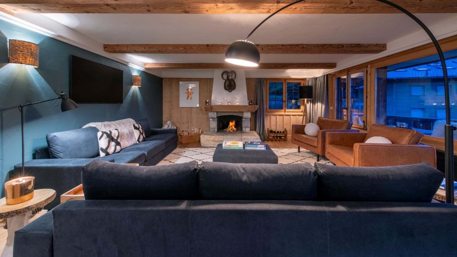 Living area with wood-burning fireplace and seating for 10