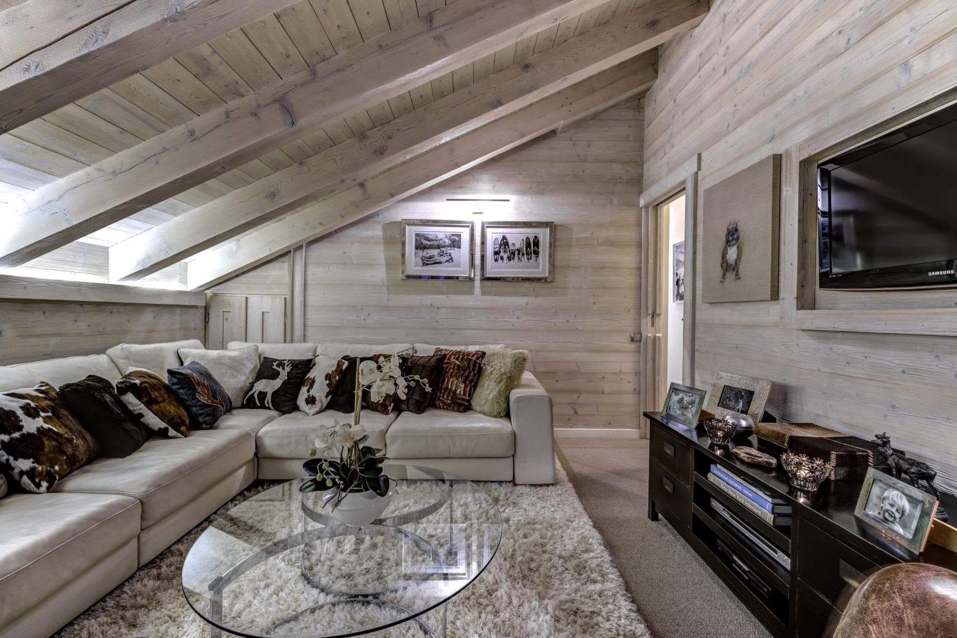 Media room with vaulted wood ceilings and sectional seating