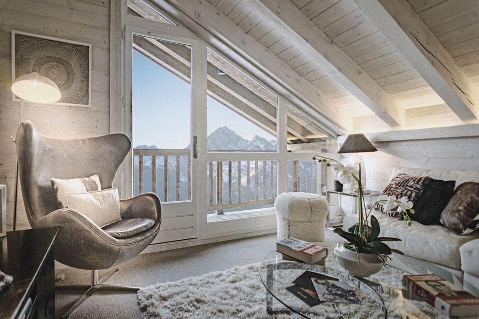 Loft sitting area with balcony access and mountain peak views