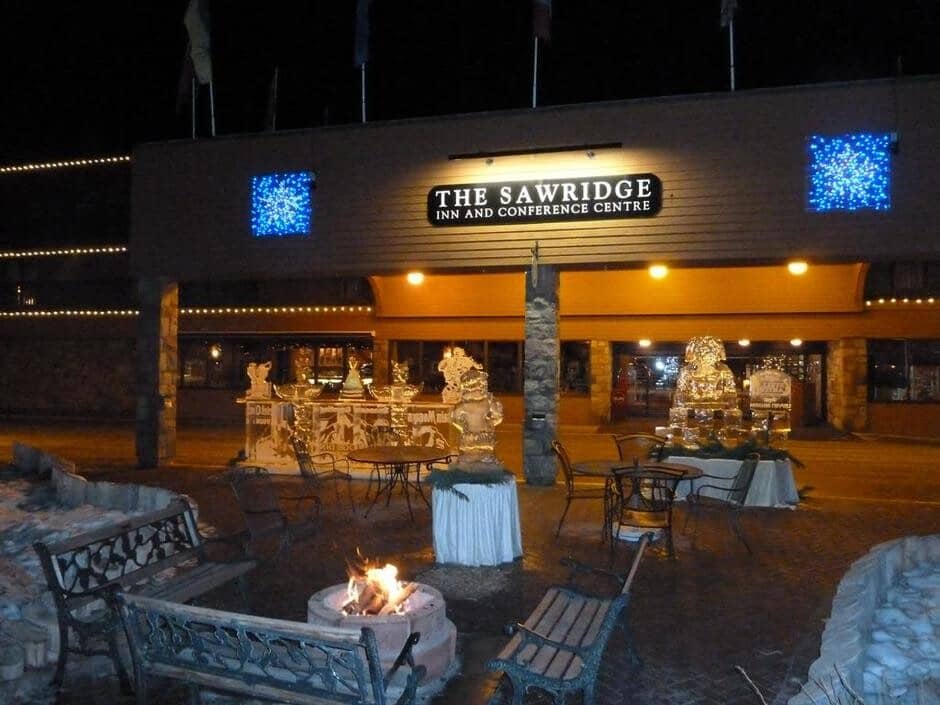 Hotel entrance with outdoor fire pit and ice sculpture display