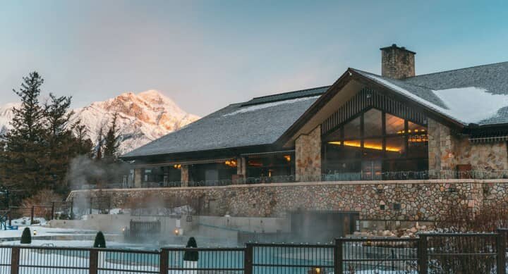 Heated outdoor pool and lodge with mountain views