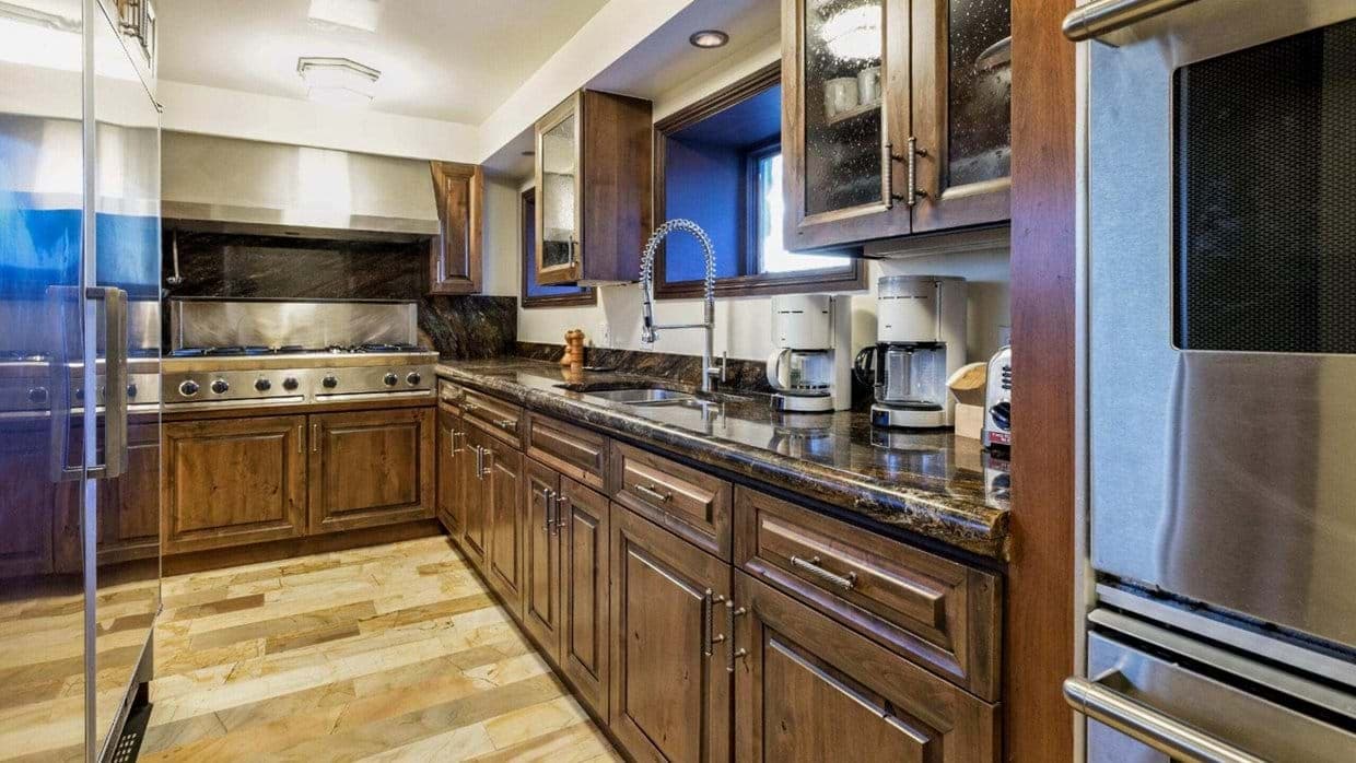 Kitchen with 6-burner gas range and dual coffee makers