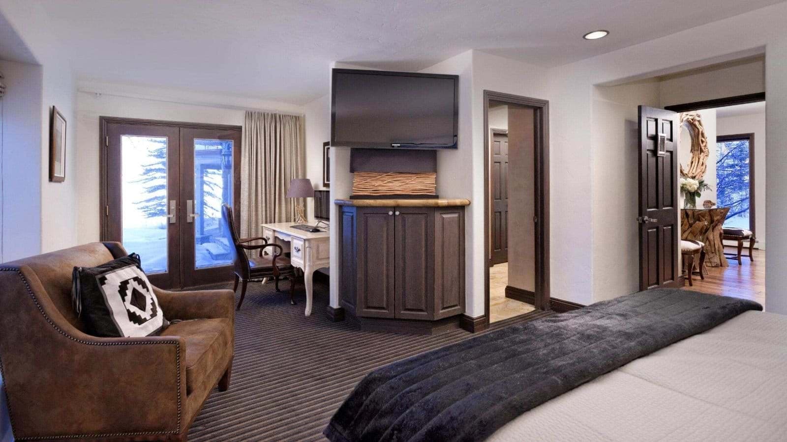 Bedroom with dedicated desk and French doors to patio