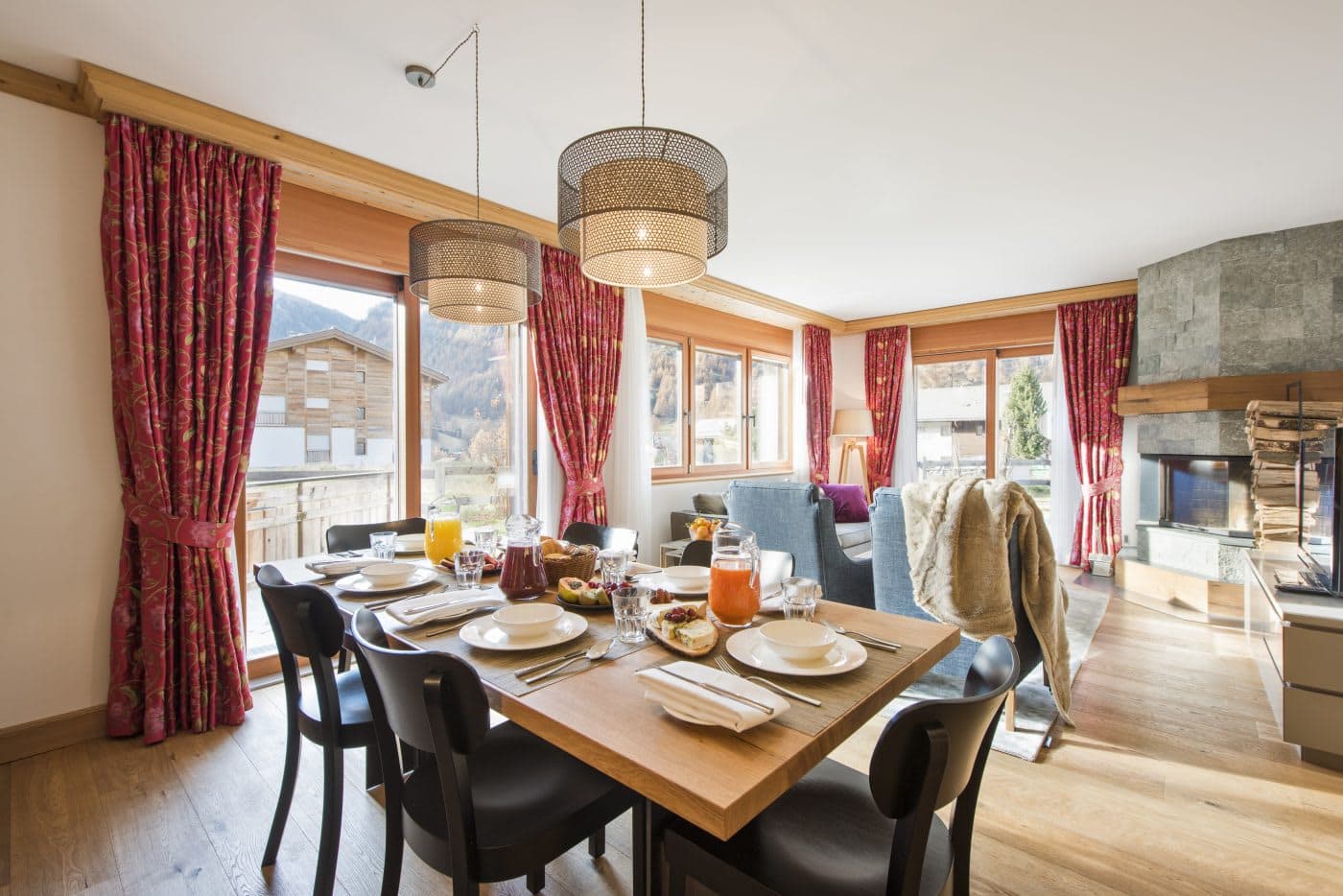 Dining area seats 6; living room with stone fireplace and mountain views