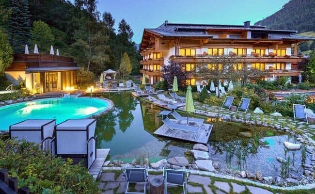 Heated outdoor pool and natural swimming pond with mountain views