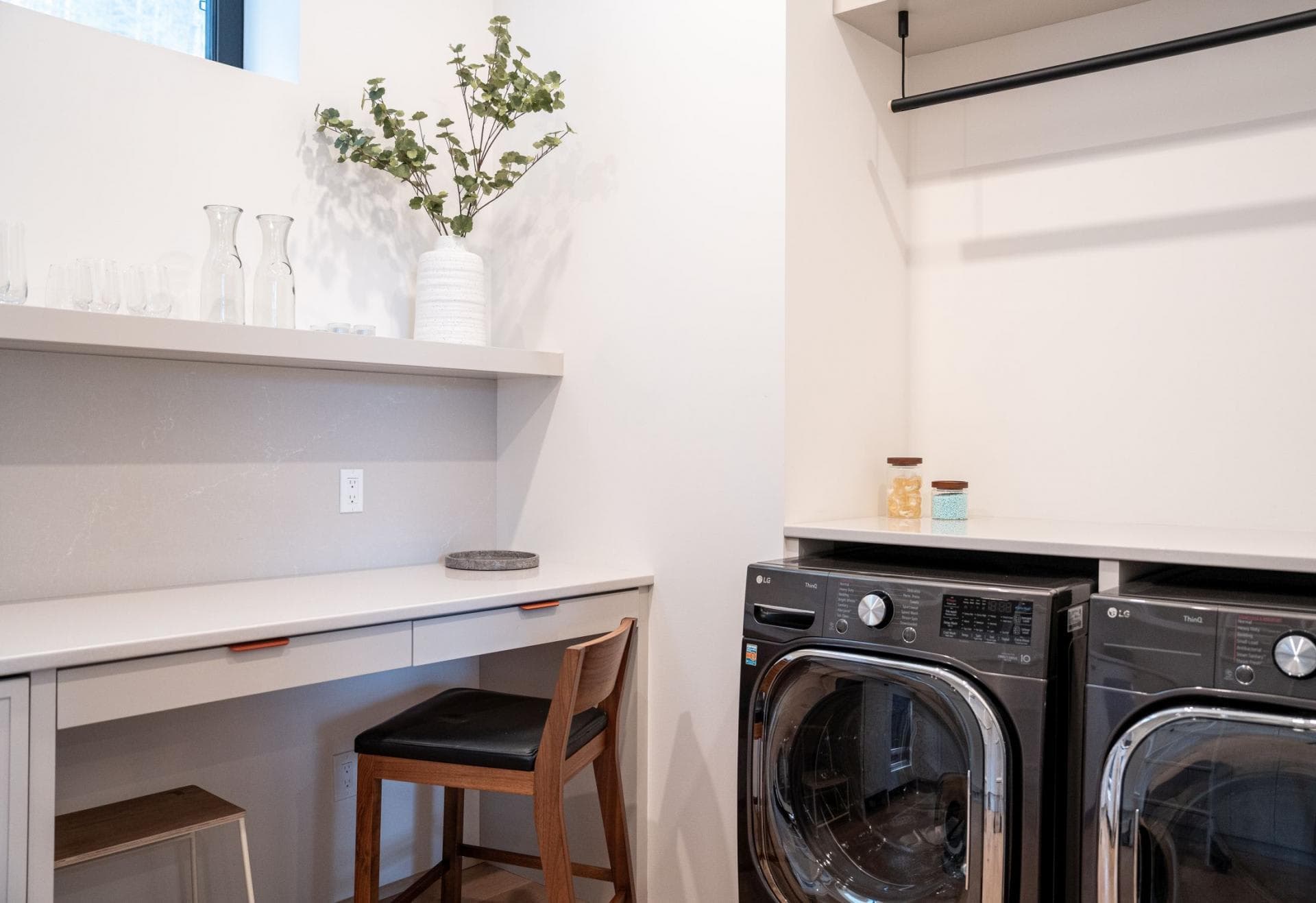 Laundry room with LG washer, dryer, and built-in desk area