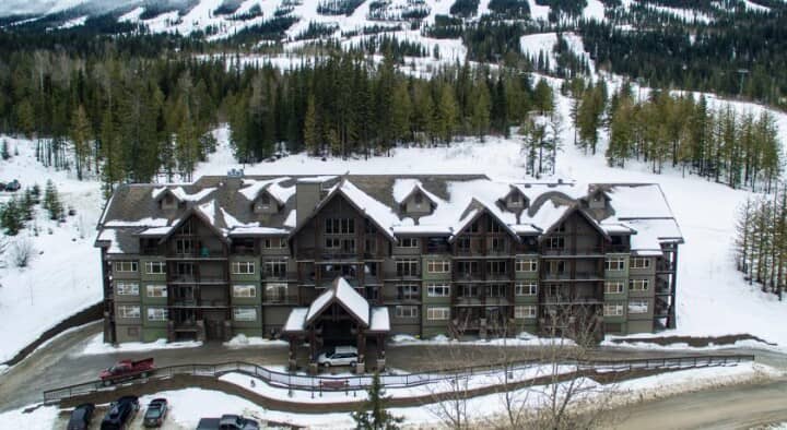 Ski-in/ski-out lodge exterior with direct access to groomed mountain runs