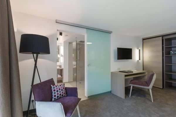 Bedroom with desk and frosted glass sliding door to ensuite