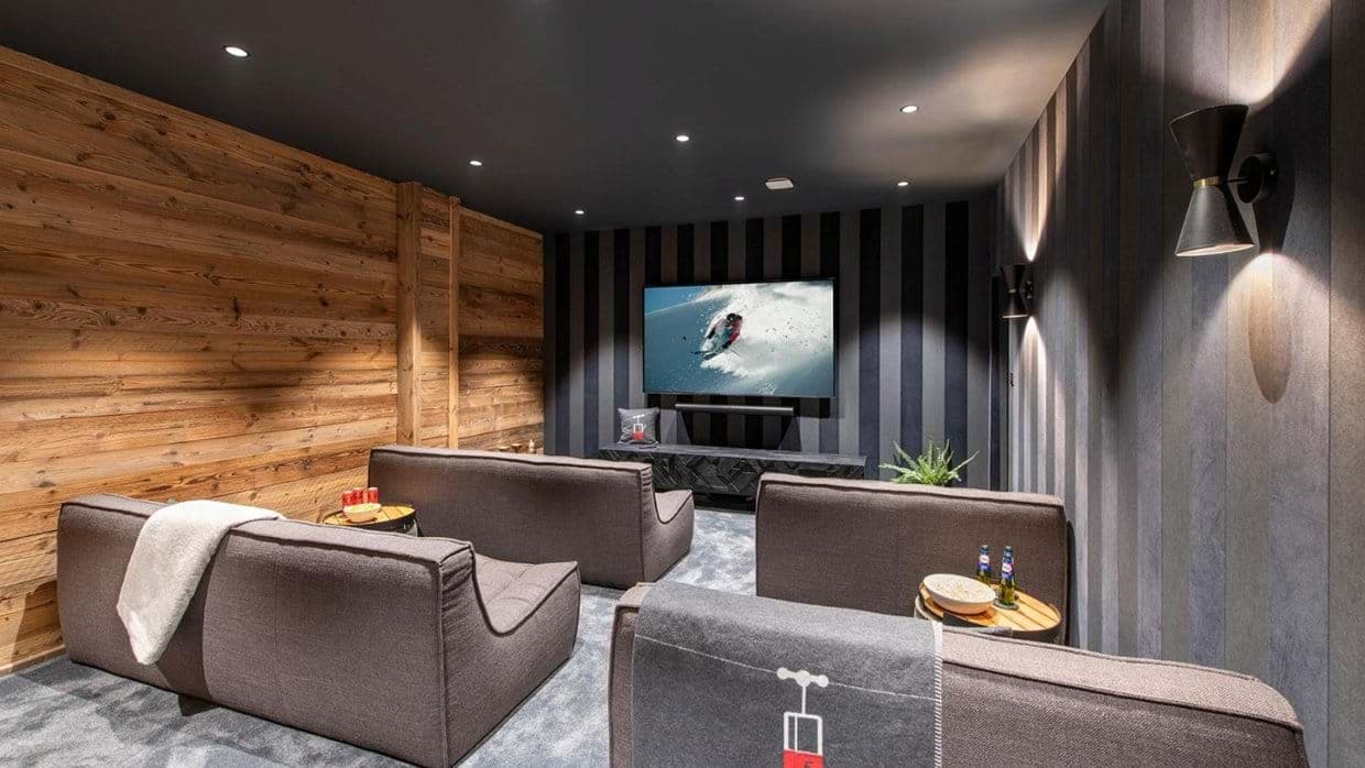 Media room with soundbar and lounge seating for four