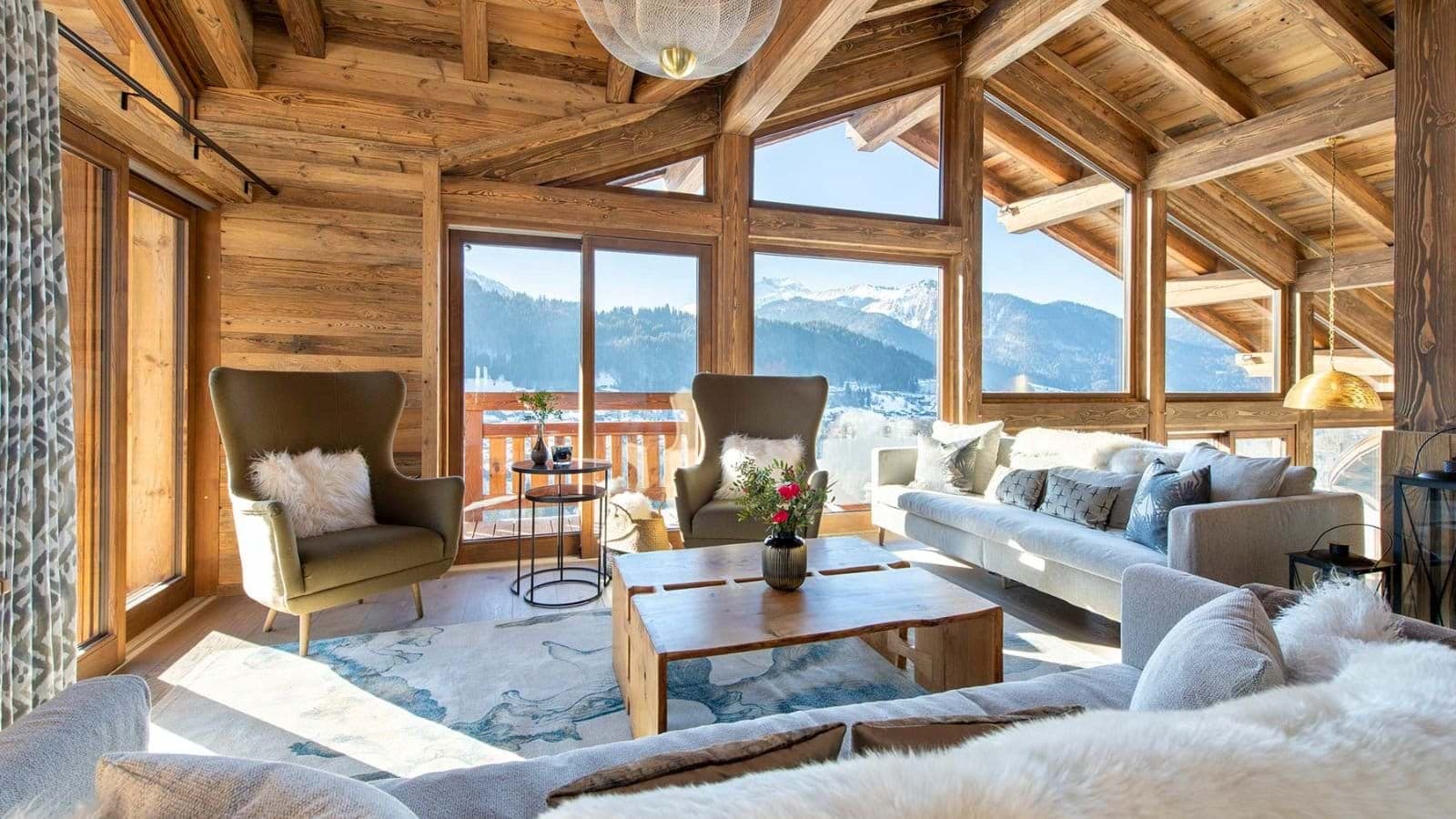 living room with vaulted wood ceilings and mountain views