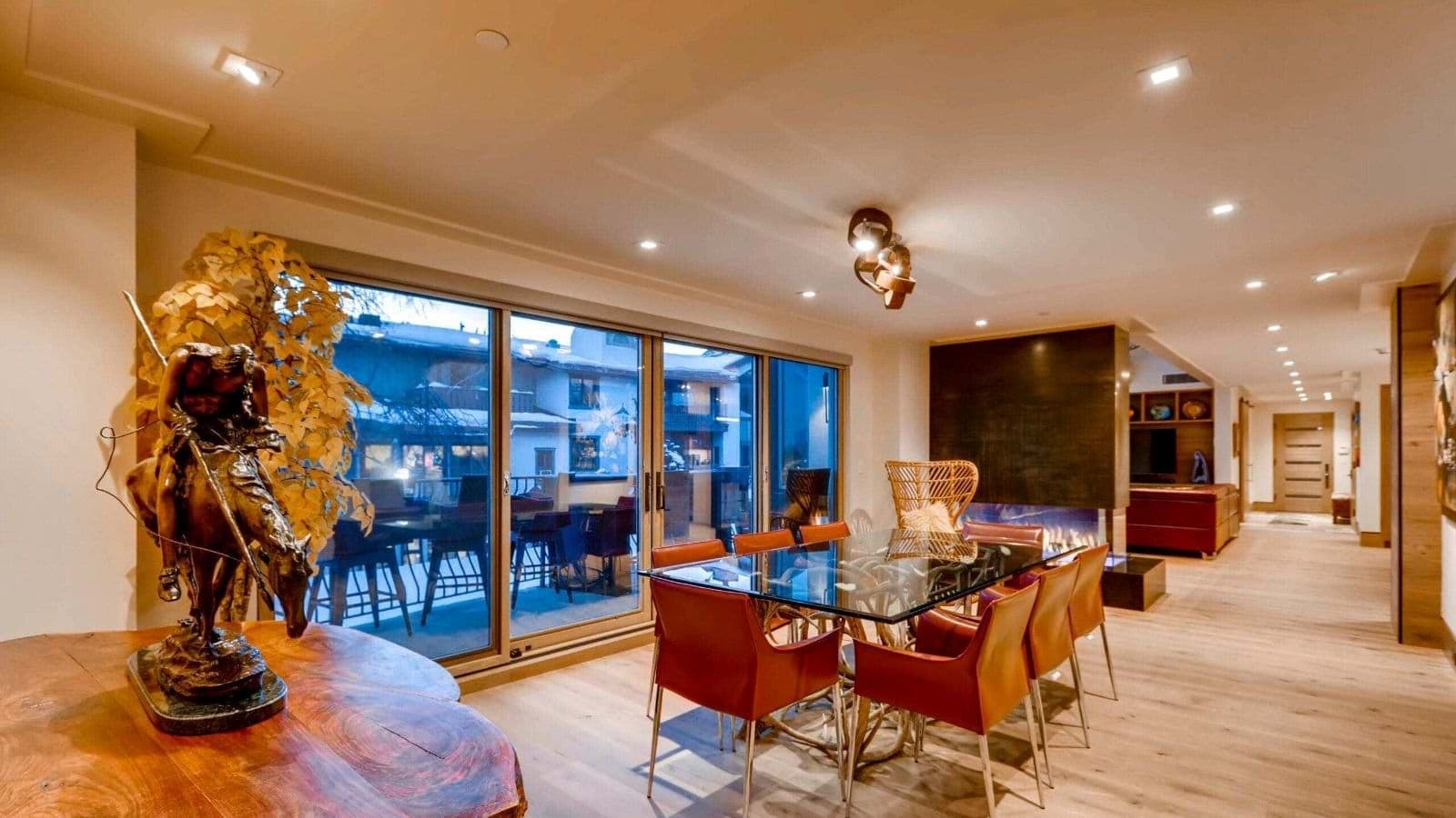 Dining area for 8 with gas fireplace and patio access