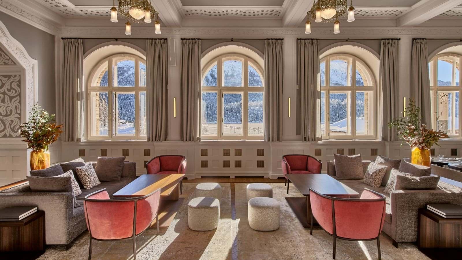 Lounge area with symmetrical seating and views of snow-covered mountains