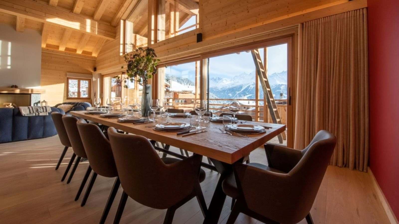 Dining area seating 10 with floor-to-ceiling mountain views